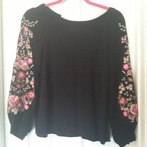 black blouse with floral embroidery
